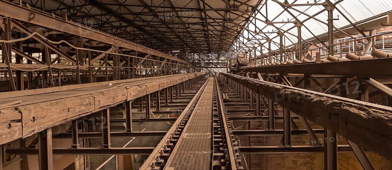 Weathered rusty industrial scenery with old rundown, steel girders and appliances