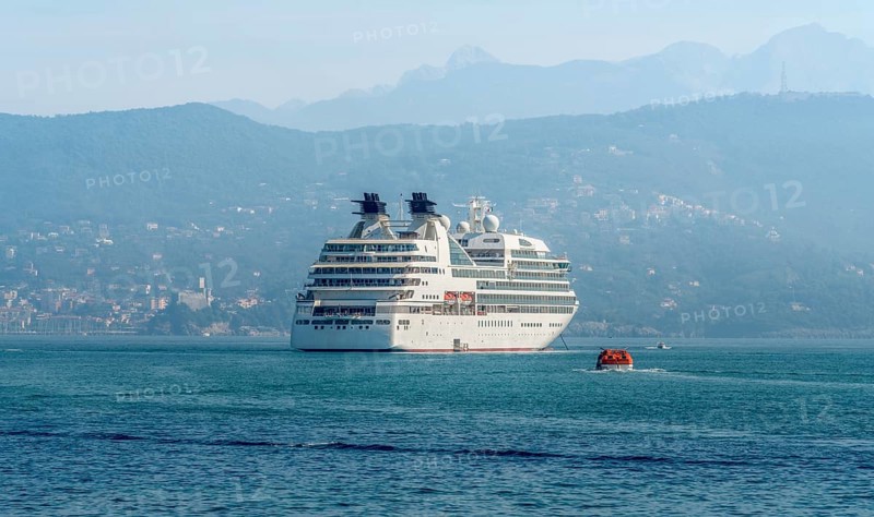 Cruise ship seen in Liguria, a region of north-western Italy in misty ambiance