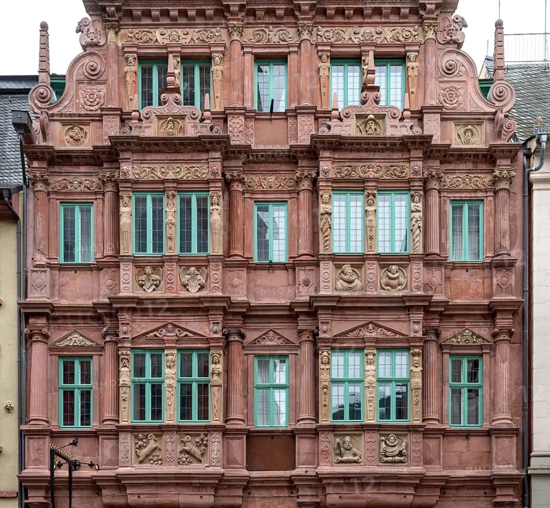 City view of Heidelberg showing a historic house facade in Germany at summer time