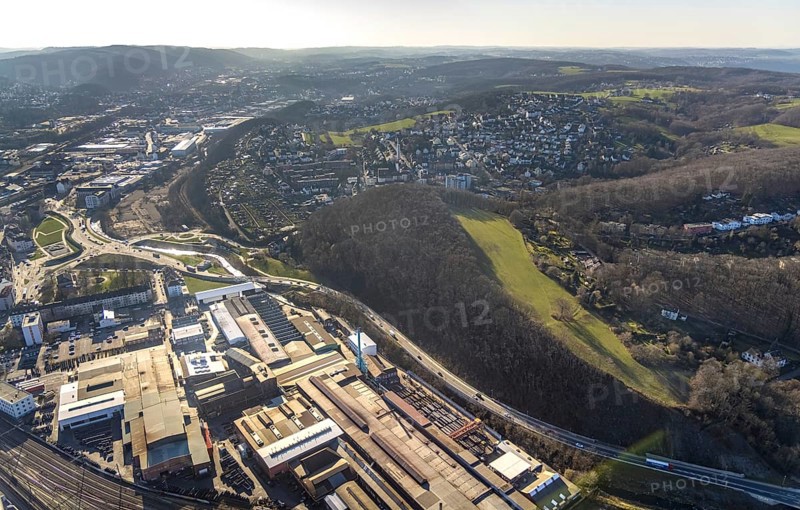 Aerial view, station background, commercial area Wehringhauser Straße, forest area Postkopf, residential area Kuhlerkamp, Wehringhausen, Hagen, Ruhr area, North Rhine-Westphalia, Germany, bridge, federal road B54, DE, through station, Europe, long-distance station, freight traffic, aerial view, aerial photography, aerial photography, passenger traffic, regional station, S-Bahn station, overview, bird's-eye view, overview