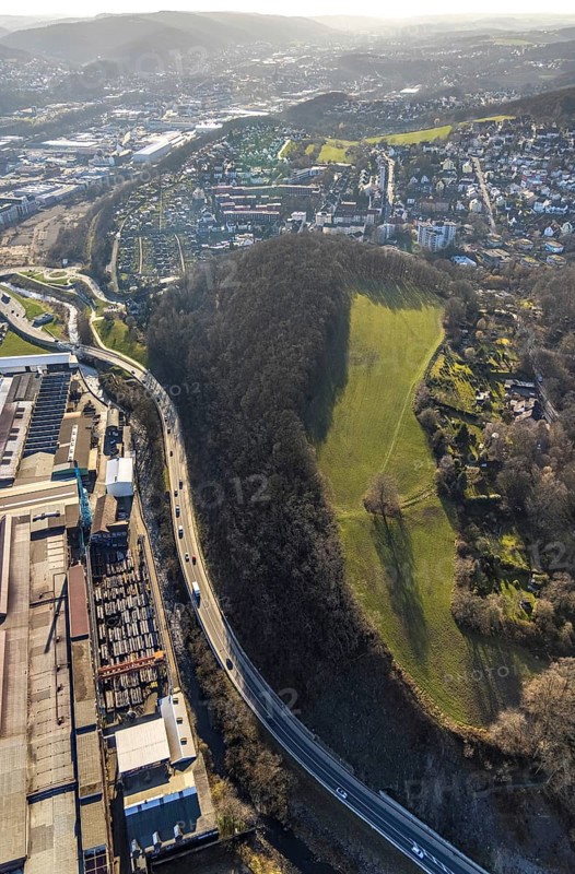 Aerial view, railway station rear view, commercial area Wehringhauser Straße, forest area Postkopf, residential area Kuhlerkamp, Cunosiedlung, Wehringhausen, Hagen, Ruhr area, North Rhine-Westphalia, Germany, bridge, federal road B54, DE, through station, Europe, long-distance railway station, property tax, freight traffic, real estate, aerial view, aerial photography, aerial photography, passenger traffic, regional railway station, suburban railway station, overview, bird's-eye view, housing estate, housing and living, residential area, residential buildings, housing quality, residential neighbourhood, housing estate, birds-eyes view, overview