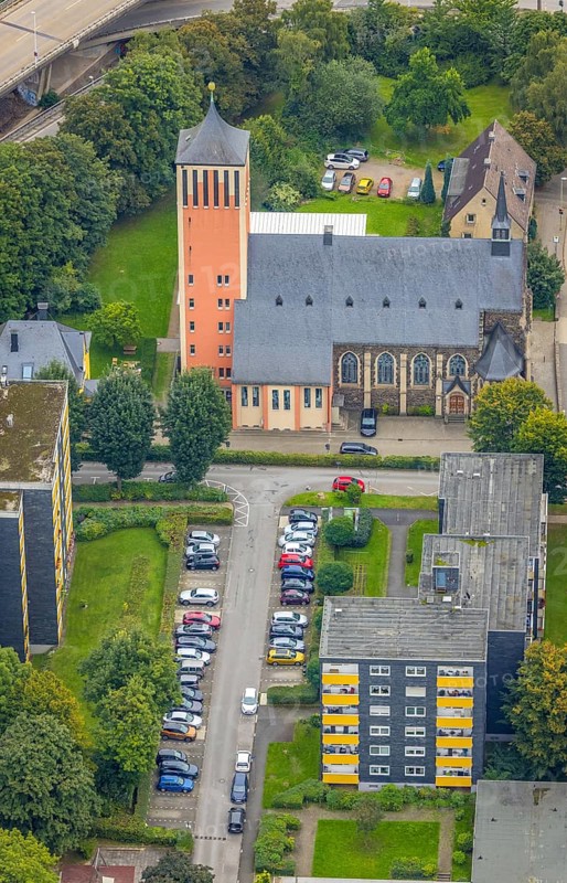 Aerial view, high-rise buildings and Catholic Church of the Sacred Heart of Jesus in the Eilpe district of Hagen, Ruhr area, North Rhine-Westphalia, Germany, place of worship, DE, Europe, religious community, place of worship, property tax, Hagen, sacred site, high-rise buildings, real estate, church, church community, denomination, aerial view, aerial photography, aerial photography, multi-family houses, religion, religious site, overview, bird's eye view, residential complex, living and life, residential buildings, housing estate, birds-eyes view, overview