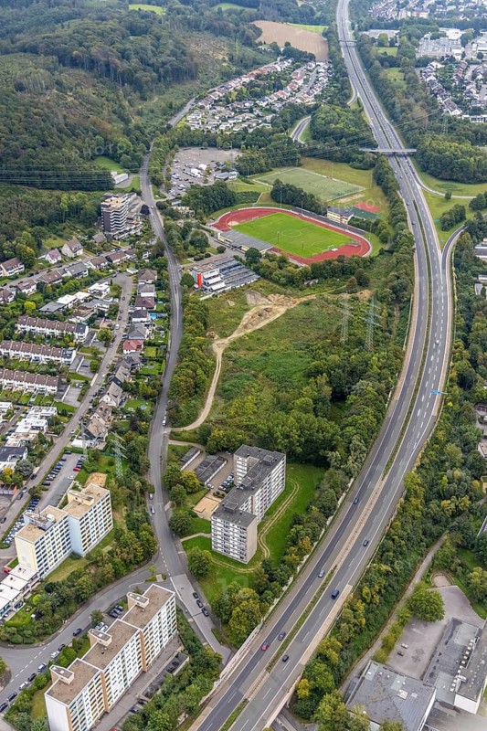 Aerial view, fallow land at the Kirchenbergstadion with planned construction of a fitness centre in the Hohenlimburg district, Hagen, Ruhr area, North Rhine-Westphalia, Germany, A46 motorway, construction area, building site, building plots, construction project, construction site, DE, Europe, football pitch, property tax, real estate, aerial view, aerial photography, aerial photography, sports, sports facilities, sports field, sports facility, overview, bird's eye view, residential complex, living and living, residential buildings, quality of living, birds-eyes view, overview