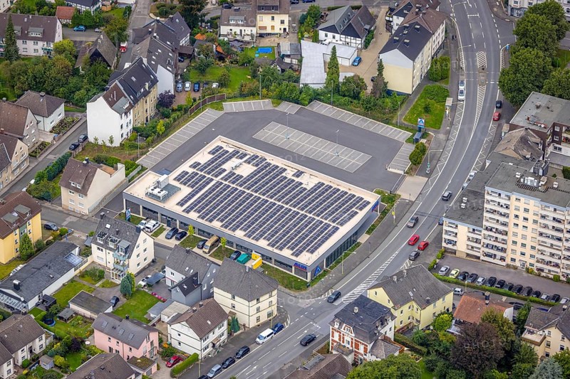 Aerial view, Aldi supermarket with solar roof on Esserstrasse in the Hohenlimburg district, Hagen, Ruhr area, North Rhine-Westphalia, Germany, DE, shopping square, shopping centre, Europe, aerial view, aerial photography, aerial photography, local supply centre, photovoltaic, photovoltaic system, solar, solar system, solar roof, solar energy, supermarket, overview, bird's-eye view, bird's-eye view, overview