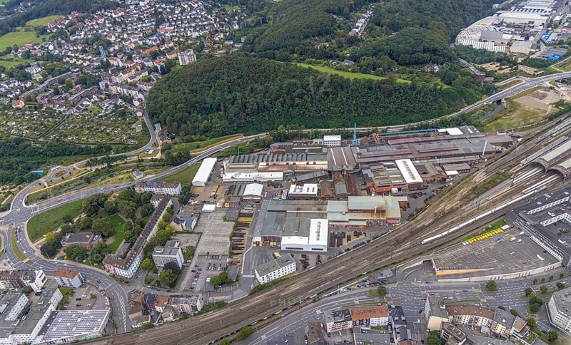 Aerial view, Deutsche Edelstahlwerke Schwanenstraße at Hagen main station and forest area Philippshöhe in the district Wehringhausen with the river Ennepe in Hagen, Ruhr area, North Rhine-Westphalia, Germany, DE, Europe, commercial enterprises, commercial area, commercial park, commercial location, commercial use, Hagen, industrial area, industrial building, industrial location, aerial view, aerial photography, aerial photography, overview, bird's-eye view, forest area, birds-eyes view, overview