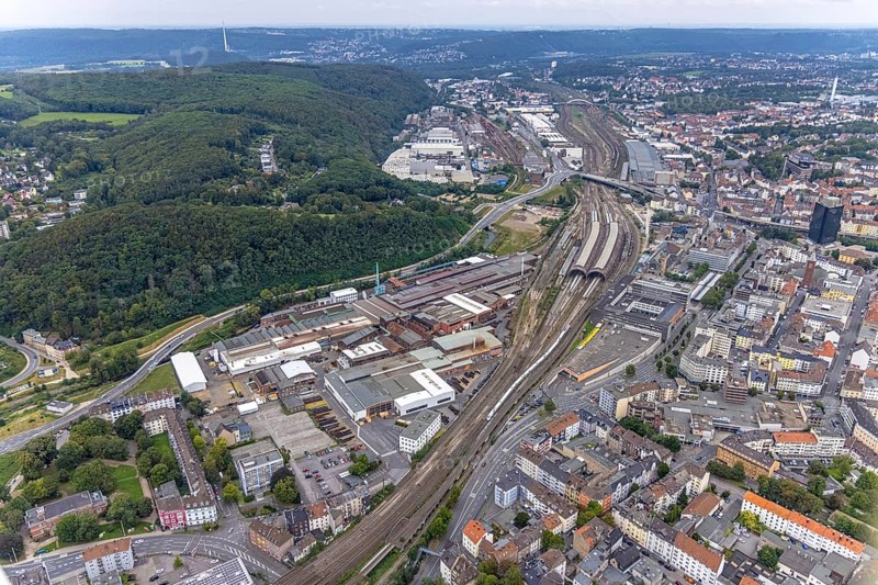 Aerial view, Deutsche Edelstahlwerke Schwanenstraße at Hagen main station and forest area Philippshöhe in the district Wehringhausen with the river Ennepe in Hagen, Ruhr area, North Rhine-Westphalia, Germany, railway tracks, railway station, DE, Deutsche Bahn AG, Europe, commercial enterprises, commercial area, commercial area, commercial park, commercial location, commercial use, Hagen, main station, main railway station, industrial area, industrial building, industrial location, aerial view, aerial photography, aerial photography, overview, bird's-eye view, forest area, birds-eyes view, overview