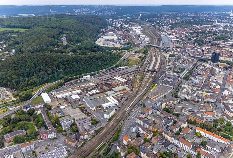 Aerial view, Deutsche Edelstahlwerke Schwanenstraße at Hagen main station and forest area Philippshöhe in the district Wehringhausen with the river Ennepe in Hagen, Ruhr area, North Rhine-Westphalia, Germany, railway tracks, railway station, DE, Deutsche Bahn AG, Europe, commercial enterprises, commercial area, commercial area, commercial park, commercial location, commercial use, Hagen, main station, main railway station, industrial area, industrial building, industrial location, aerial view, aerial photography, aerial photography, overview, bird's-eye view, forest area, birds-eyes view, overview