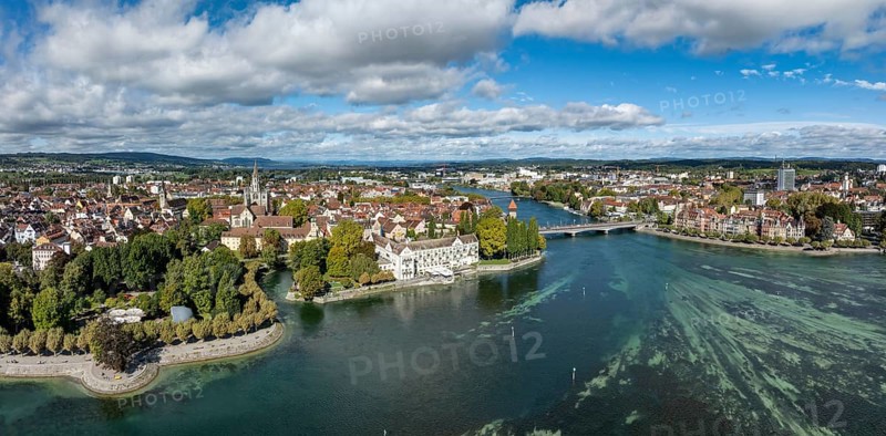 Aerial view, panorama of Lake Constance with the Seerhein, also Rhine funnel and the old town of Constance with the city garden, park on the lakeshore, promenade, on the right the Steigenberger Inselhotel, former Dominican monastery, next to it the old Rhine bridge, where the Rhine officially begins at kilometre zero, on the right the district of Petershausen, district of Constance, Baden-Württemberg, Germany