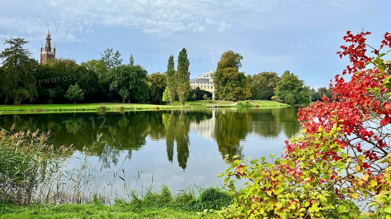 Wörlitz Park with a view of Wörlitz Palace, church, Dessau-Wörlitz Garden Kingdom, Unesco World Heritage Site, summer feeling, holiday destination, sunshine, Prince Friedrich Franz von Anhalt-Dessau, Dessau-Wörlitz Cultural Foundation, Middle Elbe Biosphere Reserve, Saxony-Anhalt, Germany