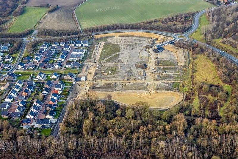 Construction area at Sachsenring with roundabout with housing estate in the district of Heessen in Hamm, Ruhr area, North Rhine-Westphalia, Germany, construction work, building, construction area, building site, building plots, construction project, construction site, DE, Europe, property tax, Hamm, real estate, roundabout, roundabout, aerial view, aerial photography, aerial photography, metropolitan region Rhine-Ruhr, new building, overview, bird's eye view, residential area, residential area, residential buildings, residential quality, residential neighbourhood, housing estate, birds-eyes view, overview