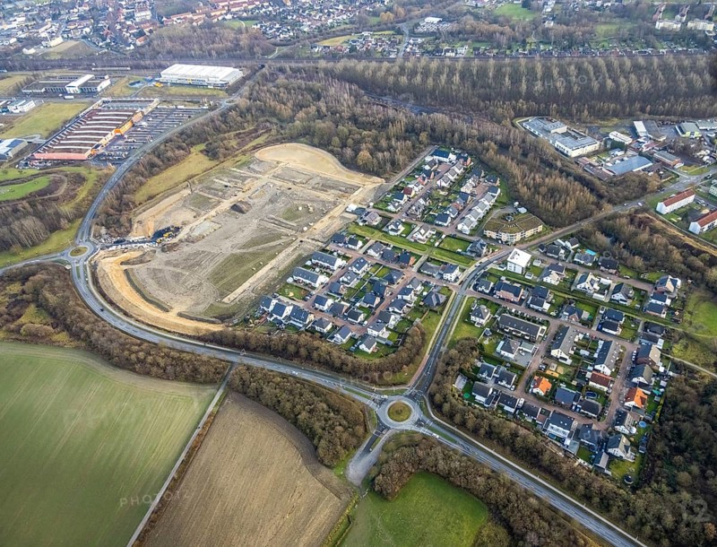 Construction area at Sachsenring with housing estate in the district of Heessen in Hamm, Ruhr area, North Rhine-Westphalia, Germany, construction work, building, construction area, building site, building plots, construction project, construction site, DE, Europe, property tax, Hamm, real estate, roundabout, roundabout, aerial view, aerial photograph, aerial photography, aerial photography, Rhine-Ruhr metropolitan region, new construction, overview, bird's-eye view, residential complex, living and living, residential area, residential buildings, residential quality, residential quarter, housing estate, birds-eyes view, overview