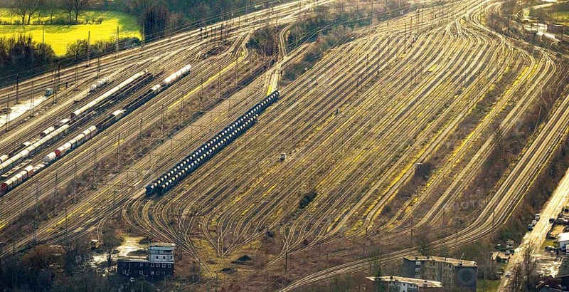 Aerial view shunting yard and freight yard in backlight in Hamm, Ruhr area, North Rhine-Westphalia, Germany, railway tracks, railway station, DE, Deutsche Bahn AG, Europe, backlight, railway tracks, Hamm, aerial view, aerial photograph, aerial photography, aerial photography, Rhine-Ruhr metropolitan region, overview, bird's eye view, birds-eyes view, former signal box, overview