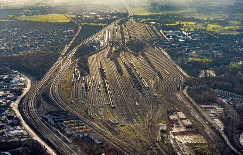 Aerial view shunting yard and freight yard in backlight in Hamm, Ruhr area, North Rhine-Westphalia, Germany, railway tracks, railway station, DE, Deutsche Bahn AG, Europe, backlight, railway tracks, Hamm, aerial view, aerial photograph, aerial photography, aerial photography, Rhine-Ruhr metropolitan region, overview, bird's eye view, birds-eyes view, former signal box, overview