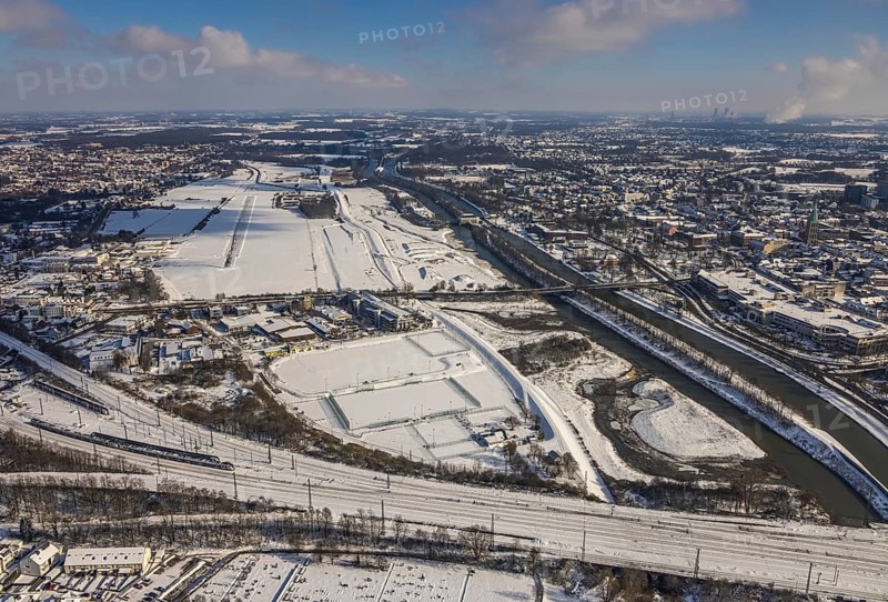 Aerial view, Hamm EDLH airfield, Lippe, Datteln-Hamm canal, bridge federal road B63 Münsterstraße, sports facility HTC Hockey- und Tennisclub Hamm, Gymnasium Hammonense, water sports centre, snow-covered areas, winter, centre, Hamm, Ruhr area, North Rhine-Westphalia, Germany, DE, Europe, aerial view, aerial photography, aerial photography, snow, overview, bird's eye view, birds-eyes, view, overview, Lippemäander, Hammonense, EDLH, waterway, shipping, transport, logistics, goods movement, ships, waters, education, pupils, college, training, school year, homework, class, year group, education, pedagogy, airfield, flying, air sports, leisure, pilot, grass pitch, artificial grass pitch, football, sport, training, football match, football pitch, hobby, championship, athlete, team, sports field, sports facility, clay court, tennis, tennis playing, tennis club