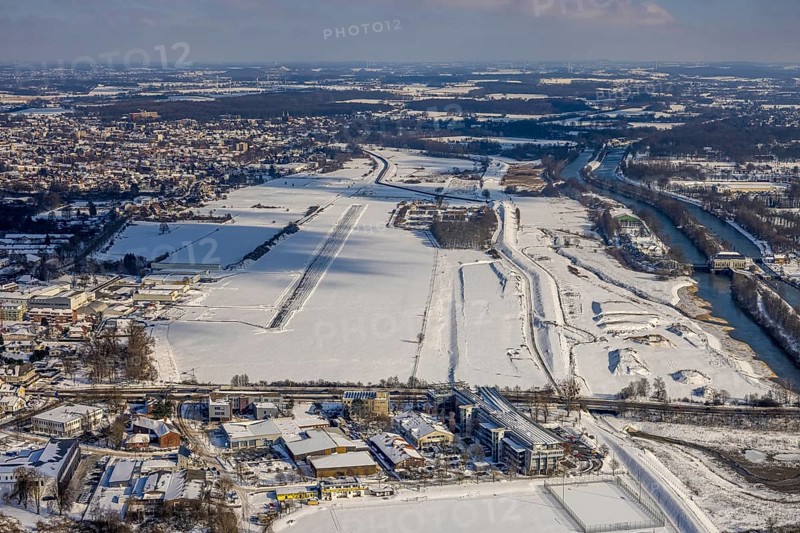 Aerial view, Hamm EDLH airfield, Lippe, Datteln-Hamm canal, bridge federal road B63 Münsterstraße, sports facility HTC Hockey- und Tennisclub Hamm, Gymnasium Hammonense, water sports centre, snow-covered areas, winter, centre, Hamm, Ruhr area, North Rhine-Westphalia, Germany, DE, Europe, aerial view, aerial photography, aerial photography, snow, overview, bird's eye view, birds-eyes, view, overview, Lippemäander, Hammonense, EDLH, waterway, shipping, transport, logistics, goods movement, ships, waters, education, pupils, college, training, school year, homework, class, year group, education, pedagogy, airfield, flying, air sports, leisure, pilot, grass pitch, artificial grass pitch, football, sport, training, football match, football pitch, hobby, championship, athlete, team, sports field, sports facility, clay court, tennis, tennis playing, tennis club