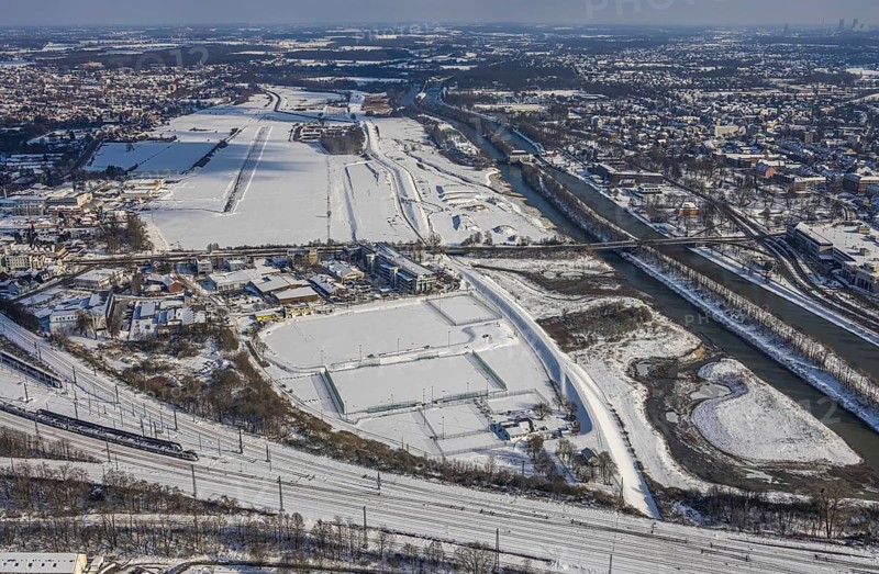 Aerial view, Hamm EDLH airfield, Lippe, Datteln-Hamm canal, bridge federal road B63 Münsterstraße, sports facility HTC Hockey- und Tennisclub Hamm, Gymnasium Hammonense, water sports centre, snow-covered areas, winter, centre, Hamm, Ruhr area, North Rhine-Westphalia, Germany, DE, Europe, aerial view, aerial photography, aerial photography, snow, overview, bird's eye view, birds-eyes, view, overview, Lippemäander, Hammonense, EDLH, waterway, shipping, transport, logistics, goods movement, ships, waters, education, pupils, college, training, school year, homework, class, year group, education, pedagogy, airfield, flying, air sports, leisure, pilot, grass pitch, artificial grass pitch, football, sport, training, football match, football pitch, hobby, championship, athlete, team, sports field, sports facility, clay court, tennis, tennis playing, tennis club