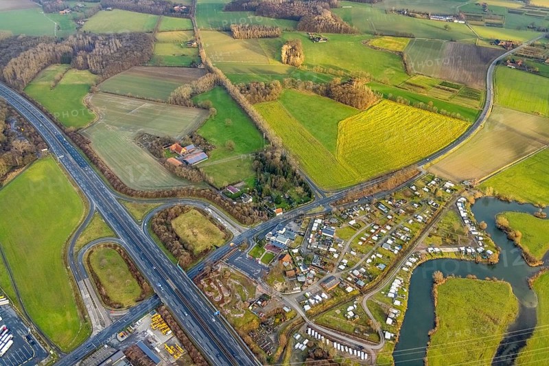 Aerial view motorway A2 with motorway junction Hamm-Uentrop and planned industrial area Westfalen Hamm/Lippetal at the main road in Hamm, Ruhr area, North Rhine-Westphalia, Germany, motorway junction, camping, camping site Uentrop Helbach, DE, Europe, river Lippe meander, commercial area, commercial area, commercial location, Hamm, industrial area, industrial location, aerial view, aerial photograph, aerial photography, aerial photography, Rhine-Ruhr metropolitan region, overview, bird's-eye view, bird's-eye view, overview