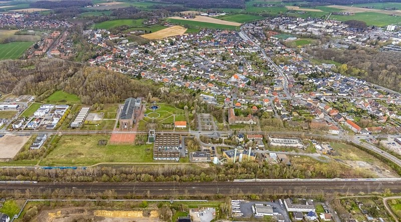 Aerial view, commercial area Ökozentrum Sachsenweg, Alfred-fisherman-Halle in Heessen, Hamm, Ruhr area, North Rhine-Westphalia, Germany, railway tracks, DE, Europe, commercial enterprises, commercial area, commercial park, commercial location, commercial use, industrial area, industrial building, industrial culture, industrial site, Keolis Deutschland GmbH, aerial view, aerial photography, aerial photography, SMT Scharf AG, Sondermann-Brot Bäckerei, overview, event location, event venue, event centre, bird's-eye view, forest area, birds-eyes view, overview, Öko-Zentrum North Rhine-Westphalia