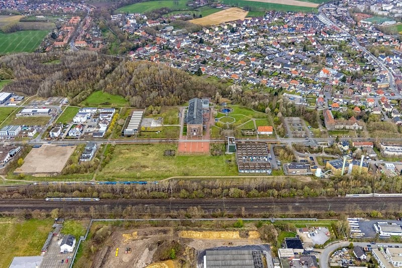 Aerial view, commercial area Ökozentrum Sachsenweg, Alfred-fisherman-Halle in Heessen, Hamm, Ruhr area, North Rhine-Westphalia, Germany, railway tracks, DE, Europe, commercial enterprises, commercial area, commercial park, commercial location, commercial use, industrial area, industrial building, industrial culture, industrial site, Keolis Deutschland GmbH, aerial view, aerial photography, aerial photography, SMT Scharf AG, Sondermann-Brot Bäckerei, overview, event location, event venue, event centre, bird's-eye view, forest area, birds-eyes view, overview, Öko-Zentrum North Rhine-Westphalia