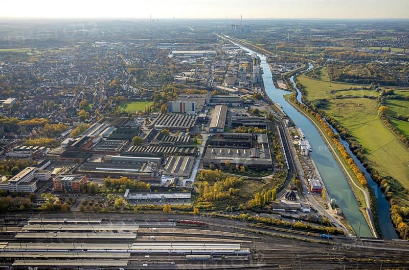 Aerial view, view from the central station to the harbour area with Datteln-Hamm canal and river Lippe and the RWE Power AG power plant Gersteinwerk in the background in the district Mitte in Hamm, Ruhr area, North Rhine-Westphalia, Germany, DE, Europe, distant view, commercial enterprises, commercial area, commercial location, commercial use, harbour, Hamm, industrial area, industrial location, canal, power plant, aerial view, aerial photography, aerial photography, overview, bird's-eye view, bird's-eye view, overview