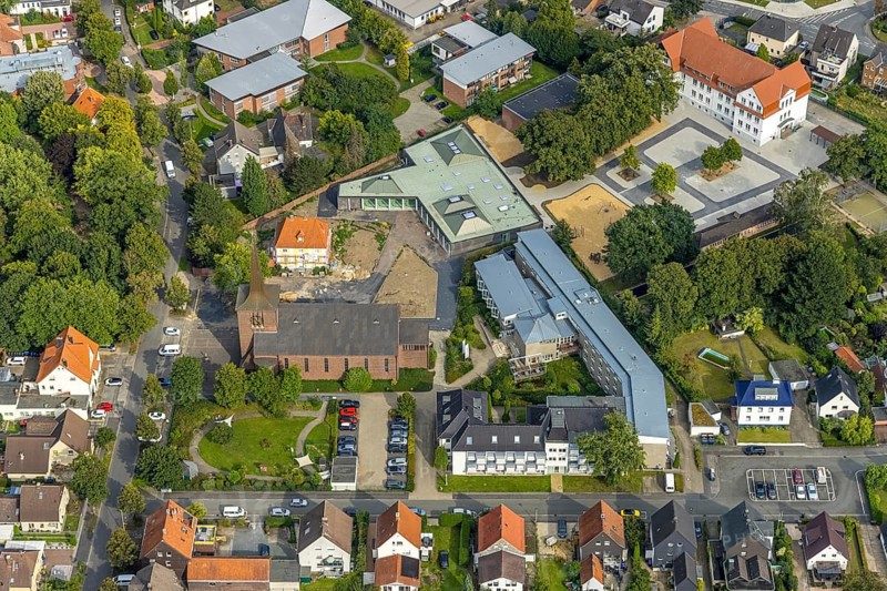 Aerial view, catholic Heilig Kreuz church and Caritas retirement home St. Josef in the district of Herringen in Hamm, Ruhr area, North Rhine-Westphalia, Germany, old people's home, retirement home, old people's home, place of worship, care and nursing, DE, Europe, religious community, place of worship, Hamm, holy place, church, parish, denomination, aerial view, aerial photography, aerial photography, care facility, religion, religious site, retirement home, retirement residence, retirement home, retirement centre, overview, bird's eye view, birds-eyes view, overview