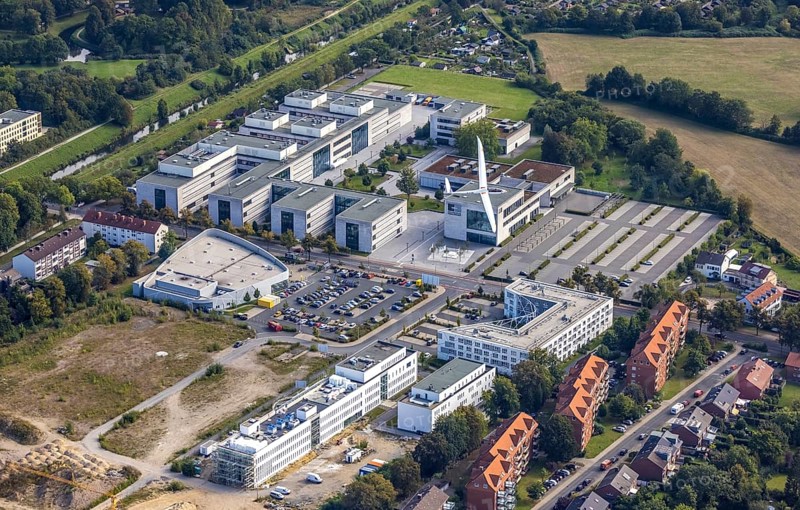 Aerial view, Hamm-Lippstadt University of Applied Sciences and the construction site at SCI:Q Science Quarter with the Duo Discus high-performance double-seater D-4199 in the Mitte district of Hamm, Ruhr area, North Rhine-Westphalia, Germany, construction work, construction, construction area, building site, building plots, construction project, construction site, education, educational institution, DE, Europe, aircraft, business park, property tax, Hamm, real estate, industrial area, aerial photography, aerial photography, aerial photography, Marker Allee, Rhine-Ruhr metropolitan region, new build, Paracelsuspark, Science Quarter Hamm, sailor, tech park, overview, university, bird's-eye view, science quarter, residential complex, living and living, residential area, residential buildings, residential quality, residential neighbourhood, housing estate, birds-eyes view, overview