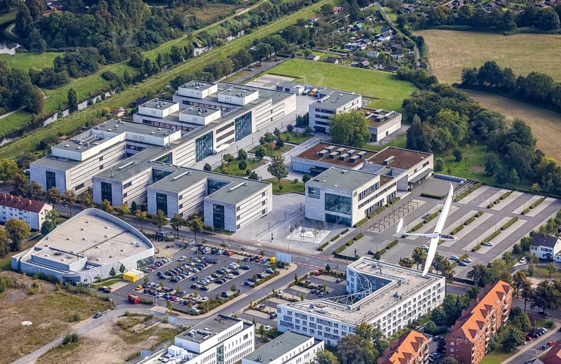 Aerial view, Hamm-Lippstadt University of Applied Sciences and the construction site at SCI:Q Science Quarter with the Duo Discus high-performance double-seater D-4199 in the Mitte district of Hamm, Ruhr area, North Rhine-Westphalia, Germany, construction work, construction, construction area, building site, building plots, construction project, construction site, education, educational institution, DE, Europe, aircraft, business park, property tax, Hamm, real estate, industrial area, aerial photography, aerial photography, aerial photography, Marker Allee, Rhine-Ruhr metropolitan region, new build, Paracelsuspark, Science Quarter Hamm, sailor, tech park, overview, university, bird's-eye view, science quarter, residential complex, living and living, residential area, residential buildings, residential quality, residential neighbourhood, housing estate, birds-eyes view, overview