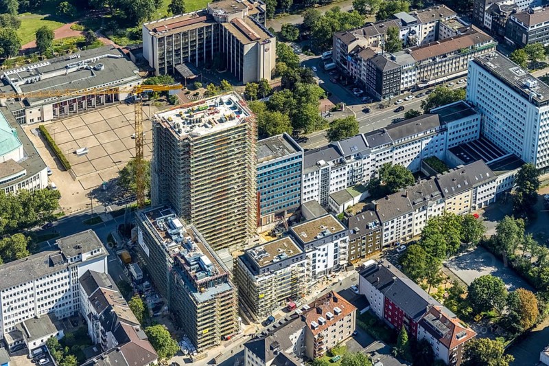 Aerial view, Philharmonie Essen and construction site new building complex with residential tower and senior citizens' flats on Huyssenallee in the southern district in Essen, Ruhr area, North Rhine-Westphalia, Germany, expansion areas, construction work, construction, construction area, construction site, construction crane, construction measure, construction project, construction site, care and nursing, DE, renewal, development, Essen, Europe, catering, hotel, hotel facilities, hotel industry, capacity requirements, concert hall, culture, art, aerial photography, aerial photography, aerial photography, new construction, care facility, retirement home, retirement centre, Sheraton Essen Hotel, overview, events, event location, event venue, event centre, bird's eye view, becoming and growing, birds-eyes view, cultural use, overview