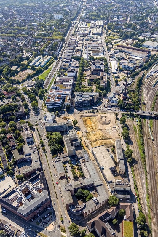 Aerial view, construction site new literature quarter for offices and flats on Sachsenstraße with demolition of the former newspaper quarter and in the background the ETEC Essener Technologie- und Entwicklungs-Centrum GmbH in the Südviertel in Essen, Ruhr area, North Rhine-Westphalia, Germany, construction work, construction area, construction site, building plots, building project, building site, DE, Essen, Europe, commercial enterprises, commercial area, commercial park, commercial location, commercial use, industrial area, industrial location, aerial view, aerial photography, aerial photography, new building, overview, bird's-eye view, overview