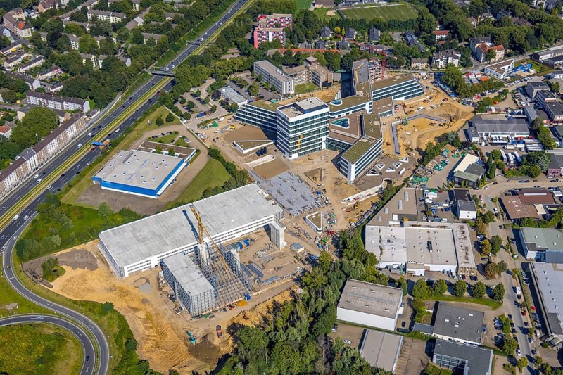 Aerial view, construction site and new construction ALDI-Nord Campus on the A40 motorway, Am Luftschacht in Essen-Kray in Essen, Ruhr area, North Rhine-Westphalia, Germany, construction work, construction area, building site, building plots, construction crane, construction project, construction site, DE, development, Essen, Europe, commercial enterprises, commercial area, commercial park, commercial site, commercial use, industrial site, capacity requirement, aerial view, aerial photography, aerial photography, new construction, overview, bird's-eye view, overview