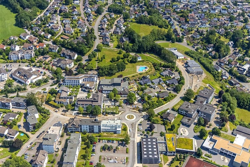 Aerial view, town hall Finnentrop Am Markt, Finto swimming pool, Bigge-Lenne comprehensive school, construction site on Kopernikusstraße, Finnentrop, Sauerland, North Rhine-Westphalia, Germany, bathing establishment, bathing resort, construction work, construction area, building site, building plots, construction project, construction site, authority, education, educational institution, DE, Europe, comprehensive school, roundabout, roundabout, educational institute, aerial view, aerial photography, aerial photography, new building, town hall, school, swimming pool, swimming pool, overview, bird's eye view, birds-eyes view, overview