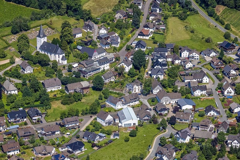 Aerial view, view of Schönholthausen, Kath. Pfarrkirche Mariä Himmelfahrt, Finnentrop, Sauerland, North Rhine-Westphalia, Germany, place of worship, burial place, DE, Europe, cemetery, memorial, religious community, place of worship, house of God, land tax, burial ground, holy place, real estate, church, parish, denomination, aerial view, aerial photography, aerial photography, religion, religious site, resting place, overview, bird's-eye view, housing estate, housing and living, residential area, residential buildings, housing quality, housing estate, birds-eyes view, overview