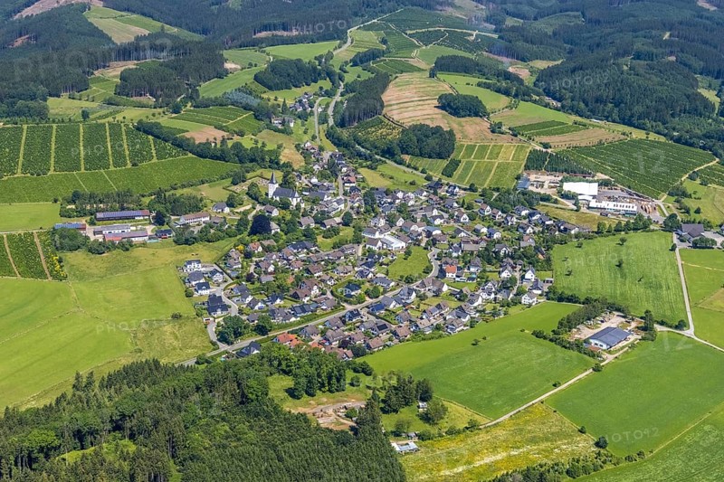Aerial view, local view Schönholthausen, Catholic parish church Mariä Himmelfahrt, Finnentrop, Sauerland, North Rhine-Westphalia, Germany, place of worship, DE, Europe, religious community, place of worship, property tax, holy place, real estate, church, church community, denomination, aerial view, aerial photography, aerial photography, religion, religious site, overview, bird's eye view, residential complex, living and life, residential area, residential buildings, residential quality, housing estate, birds-eyes view, overview