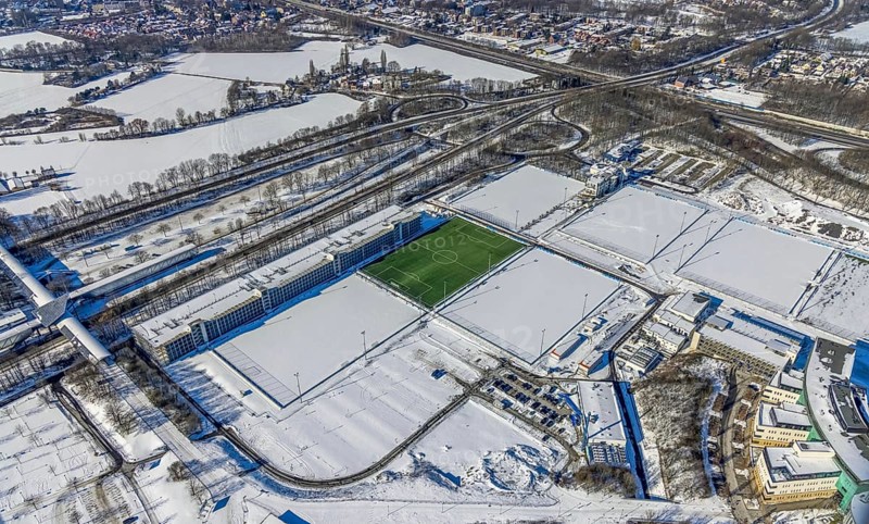 Aerial view, training ground in the snow at the Veltins-Arena, new car park Stan-Libuda-Weg, Erle, Gelsenkirchen, Ruhr area, North Rhine-Westphalia, Germany, Berger Feld, DE, Europe, FC Schalke 04, distant view, football pitch, football stadium, football club, hotel business, aerial view, aerial photography, aerial photography, snow, sports, sports facilities, sports field, sports facility, training grounds, overview, bird's eye view, winter, birds-eyes view, overview