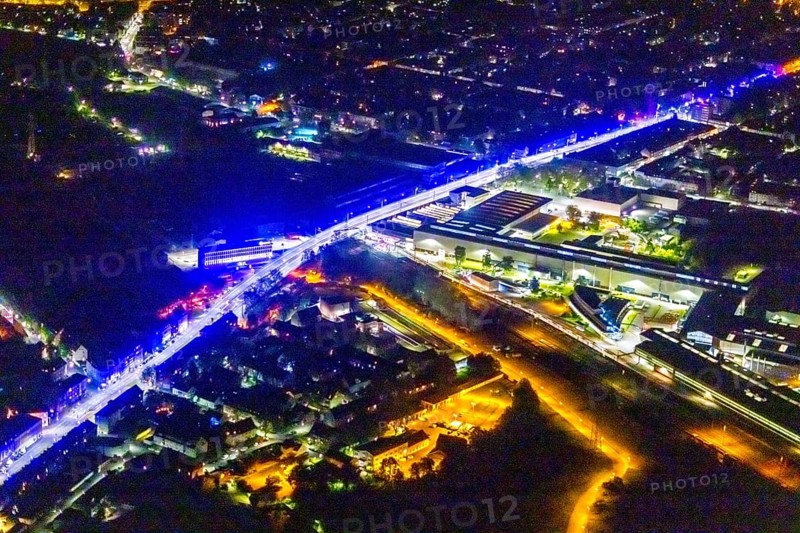 Aerial view, lighting in Schalke blue, Schalke 04, Kurt-Schumacher Straße with thyssenkrupp Electrical Steel GmbH, Schalke, Gelsenkirchen, Ruhr area, North Rhine-Westphalia, Germany, DE, twilight photography, Europe, commercial enterprises, commercial area, commercial park, commercial location, commercial use, industrial area, industrial site, light pollution, aerial view, aerial photography, aerial photography, night, night photography, night flight, overview, bird's-eye view, illuminated streets, birds-eyes view, blue band, blue light, artificial light, nightflight, overview