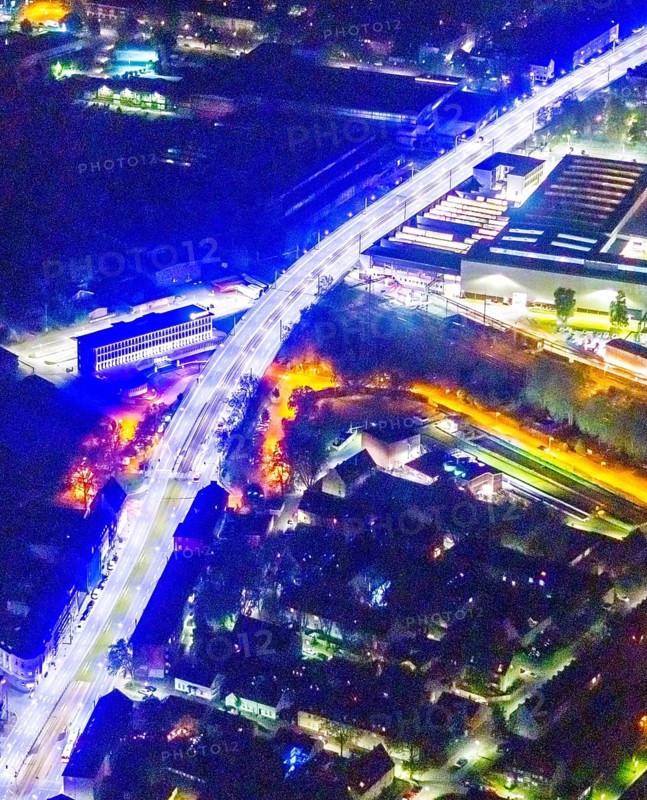 Aerial view, lighting in Schalke blue, Schalke 04, Kurt-Schumacher Straße with thyssenkrupp Electrical Steel GmbH, Schalke, Gelsenkirchen, Ruhr area, North Rhine-Westphalia, Germany, DE, twilight photography, Europe, commercial enterprises, commercial area, commercial park, commercial location, commercial use, industrial area, industrial site, light pollution, aerial view, aerial photography, aerial photography, night, night photography, night flight, overview, bird's-eye view, illuminated streets, birds-eyes view, blue band, blue light, artificial light, nightflight, overview