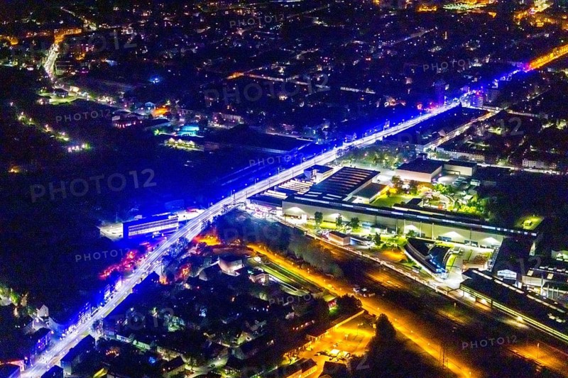 Aerial view, lighting in Schalke blue, Schalke 04, Kurt-Schumacher Straße with thyssenkrupp Electrical Steel GmbH, Schalke, Gelsenkirchen, Ruhr area, North Rhine-Westphalia, Germany, DE, twilight photography, Europe, commercial enterprises, commercial area, commercial park, commercial location, commercial use, industrial area, industrial site, light pollution, aerial view, aerial photography, aerial photography, night, night photography, night flight, overview, bird's-eye view, illuminated streets, birds-eyes view, blue band, blue light, artificial light, nightflight, overview