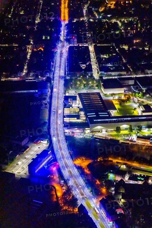 Aerial view, lighting in Schalke blue, Schalke 04, Kurt-Schumacher Straße with thyssenkrupp Electrical Steel GmbH, Schalke, Gelsenkirchen, Ruhr area, North Rhine-Westphalia, Germany, DE, twilight photography, Europe, commercial enterprises, commercial area, commercial park, commercial location, commercial use, industrial area, industrial site, light pollution, aerial view, aerial photography, aerial photography, night, night photography, night flight, overview, bird's-eye view, illuminated streets, birds-eyes view, blue band, blue light, artificial light, nightflight, overview