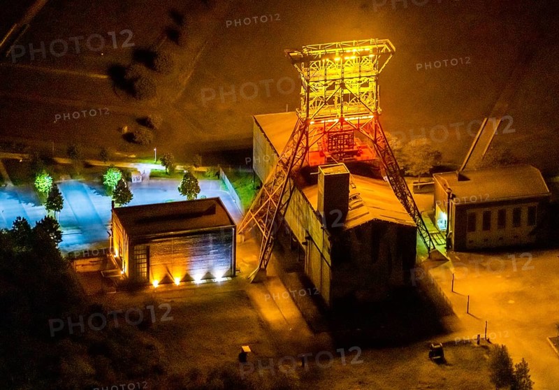 Aerial view, headframe shaft IX with engine houses in Consol Park, Bismarck, Gelsenkirchen, Ruhr area, North Rhine-Westphalia, Germany, Consol Yellow Art, DE, twilight photography, Europe, headframe, winding tower, light art installation, light pollution, aerial view, aerial photography, aerial photography, north engine house, south engine house, night, night shot, night flight, overview, bird's eye view, Consolidation colliery, illuminated streets, birds-eyes view, nightflight, overview