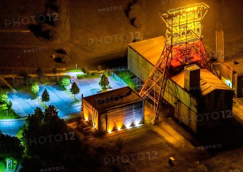 Aerial view, headframe shaft IX with engine houses in Consol Park, Bismarck, Gelsenkirchen, Ruhr area, North Rhine-Westphalia, Germany, Consol Yellow Art, DE, twilight photography, Europe, headframe, winding tower, light art installation, light pollution, aerial view, aerial photography, aerial photography, north engine house, south engine house, night, night shot, night flight, overview, bird's eye view, Consolidation colliery, illuminated streets, birds-eyes view, nightflight, overview