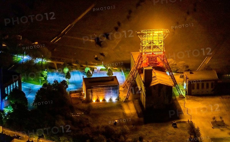 Aerial view, headframe shaft IX with engine houses in Consol Park, Bismarck, Gelsenkirchen, Ruhr area, North Rhine-Westphalia, Germany, Consol Yellow Art, DE, twilight photography, Europe, headframe, winding tower, light art installation, light pollution, aerial view, aerial photography, aerial photography, north engine house, south engine house, night, night shot, night flight, overview, bird's eye view, Consolidation colliery, illuminated streets, birds-eyes view, nightflight, overview