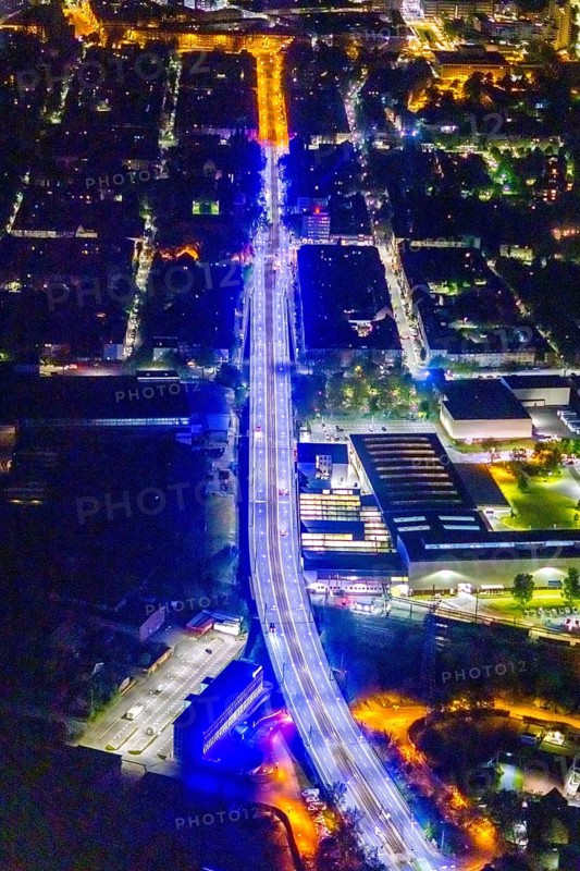 Aerial view, illumination in Schalke blue, Schalke 04, Kurt-Schumacher Straße with thyssenkrupp Electrical Steel GmbH, Schalke, Gelsenkirchen, Ruhr area, North Rhine-Westphalia, Germany, DE, twilight photography, Europe, commercial enterprises, commercial area, commercial park, commercial location, commercial use, industrial area, industrial site, light pollution, aerial view, aerial photography, aerial photography, night, night photography, night flight, overview, bird's-eye view, illuminated streets, birds-eyes view, blue band, blue light, artificial light, nightflight, overview