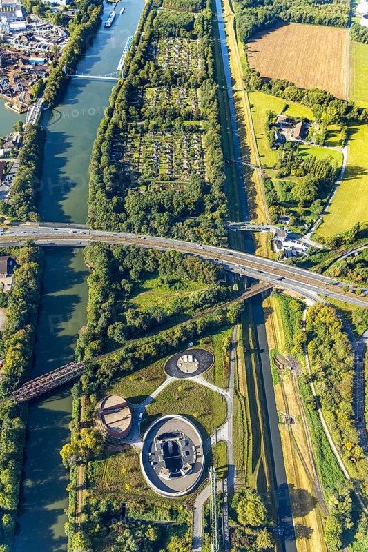 Aerial view, New pumping station building of the Emschergenossenschaft near the Sutumer Brücken on the lock island between the Rhine-Herne Canal and the river Emscher in the district of Schalke-Nord in Gelsenkirchen, Ruhr area, North Rhine-Westphalia, Germany, sewage pumping station, DE, Emschergenossenschaft, Emscher Island, Europe, Gelsenkirchen, community garden, allotment garden, allotment garden site, allotment garden site Bismarck-West, allotment garden association, aerial view, aerial photography, aerial photography, allotment garden, overview, bird's-eye view, birds-eyes view, overview