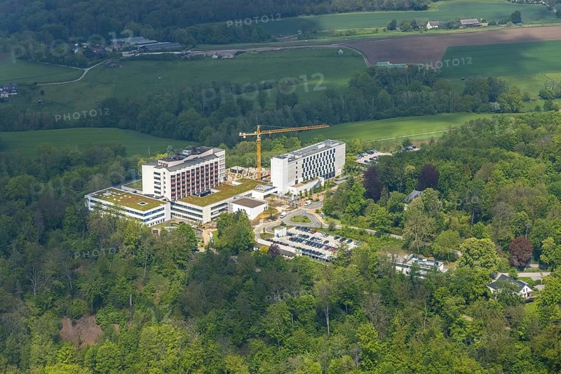 Aerial view, Ruhrlandklinik with construction site, Essen-Heidhausen, Essen, Ruhr area, North Rhine-Westphalia, Germany, construction work, construction area, construction site, building plots, construction crane, construction measure, construction project, construction site, DE, Europe, specialist clinic, healthcare, hospital, clinic, clinic centre, hospital, aerial photograph, aerial photography, aerial photography, medical facility, medical aid, new building, emergency service, Tüschener Weg, overview, bird's eye view, birds-eyes view, overview, medical care