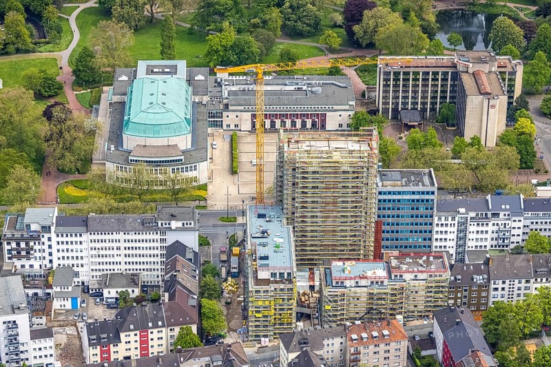 Aerial view, Philharmonie Essen on Huyssenallee, construction site, new building complex with residential tower and senior citizens' flats Huyssenallee, Essen, Ruhr area, North Rhine-Westphalia, Germany, construction work, construction, construction area, construction site, construction crane, construction measure, construction project, construction site, care and nursing, DE, renewal, development, Europe, catering, hotel, hotel facilities, hotel industry, capacity requirements, concert hall, culture, art, aerial photography, aerial photography, aerial photography, new building, care facility, retirement home, retirement centre, Sheraton Essen Hotel, overview, events, venue, event location, event centre, bird's eye view, birds-eyes view, cultural use, overview