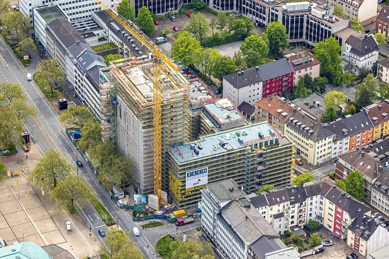 Aerial view, construction site, new building complex with residential tower and senior citizens' flats Huyssenallee, Essen, Ruhr area, North Rhine-Westphalia, Germany, construction work, construction, construction area, construction site, construction crane, construction measure, construction project, construction site, care and nursing, DE, renewal, development, Europe, capacity requirements, concert hall, aerial view, aerial photography, aerial photography, new building, care facility, retirement home, retirement centre, Sheraton Essen Hotel, overview, bird's eye view, bird's eye view, overview