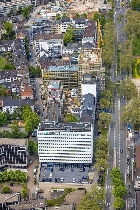 Aerial view, construction site, new building complex with residential tower and senior citizens' flats Huyssenallee, Essen, Ruhr area, North Rhine-Westphalia, Germany, construction work, construction, construction area, construction site, construction crane, construction measure, construction project, construction site, care and nursing, DE, renewal, development, Europe, capacity requirements, concert hall, aerial view, aerial photography, aerial photography, new building, care facility, retirement home, retirement centre, Sheraton Essen Hotel, overview, bird's-eye view, birds-eyes view, overview