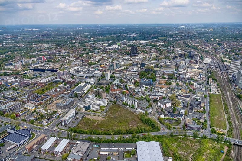 Aerial view, brownfield Schwanenkampstraße, construction site and new office building at the corner of Frohnhauser Straße and Kurt-Jooss-Straße, City, Westviertel, Essen, Ruhr area, North Rhine-Westphalia, Germany, construction work, construction area, construction site, building plots, construction project, construction site, DE, Europe, city centre, aerial view, aerial photography, aerial photography, new building, city centre, overview, bird's eye view, overview