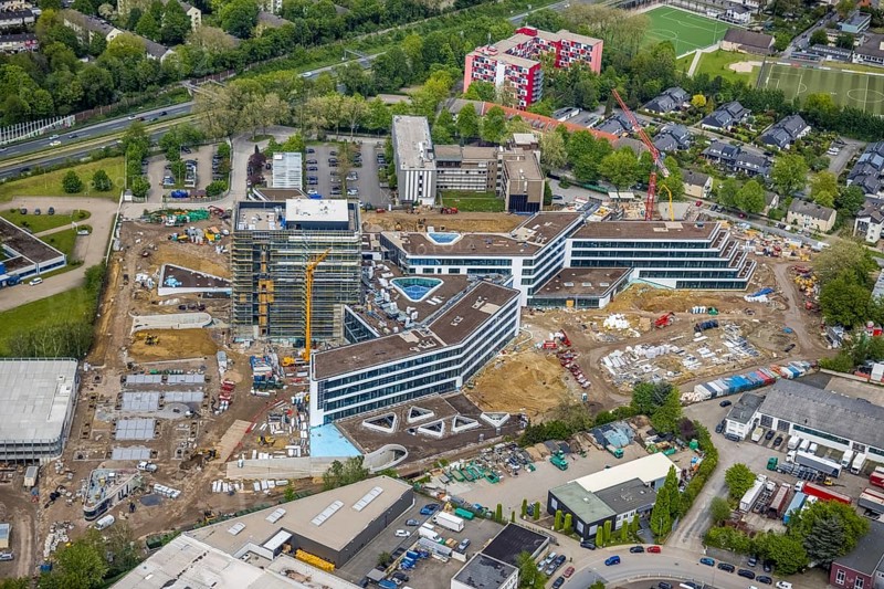 Aerial view, new construction and construction site ALDI-Nord Campus, Eckenbergstraße, Hängebank, Essen-Kray, Essen, Ruhr area, North Rhine-Westphalia, Germany, construction work, construction area, building site, building plots, construction crane, construction project, construction site, DE, development, Europe, commercial enterprises, commercial area, commercial park, commercial site, commercial use, industrial site, aerial photograph, aerial photography, aerial photography, new construction, overview, bird's eye view, bird's eye view, overview