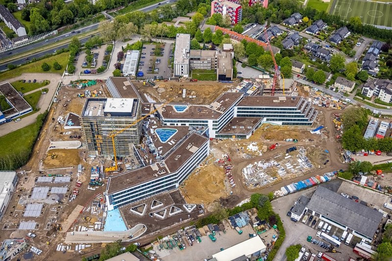 Aerial view, new construction and construction site ALDI-Nord Campus, Eckenbergstraße, Hängebank, Essen-Kray, Essen, Ruhr area, North Rhine-Westphalia, Germany, construction work, construction area, building site, building plots, construction crane, construction project, construction site, DE, development, Europe, commercial enterprises, commercial area, commercial park, commercial site, commercial use, industrial site, aerial photograph, aerial photography, aerial photography, new construction, overview, bird's eye view, bird's eye view, overview
